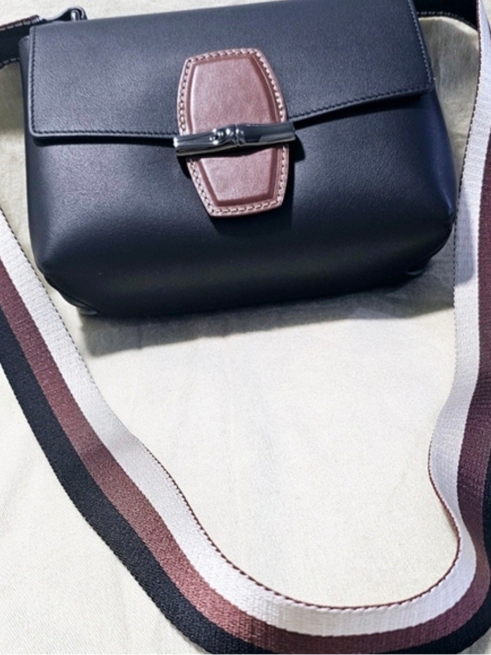 Classic Black Crossbody Bag with Brown Accent Strap